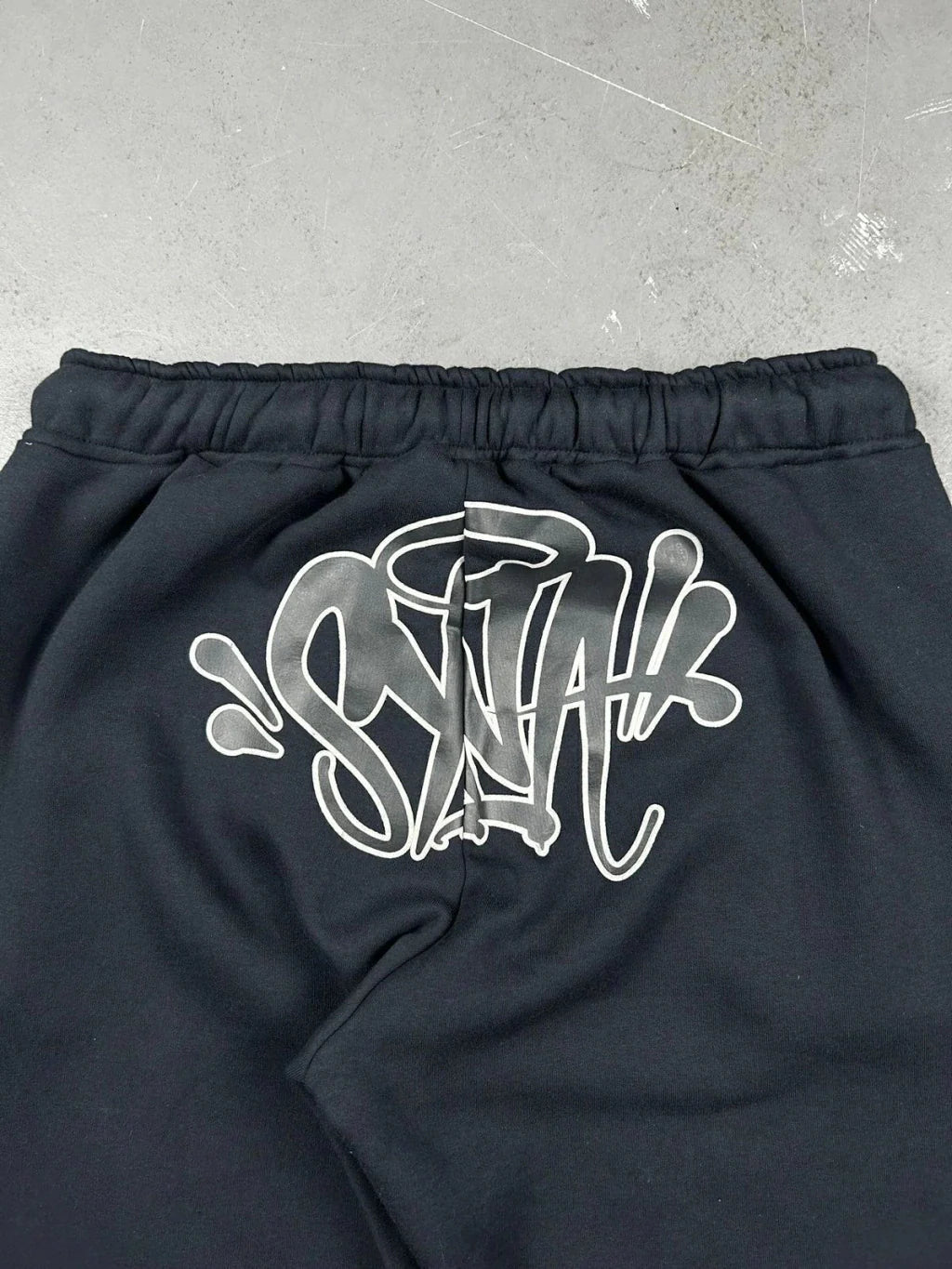 CONJUNTO SYNA WORLD LOGO